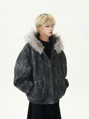 Person wearing a dark gray jacket with fur trim on a white background