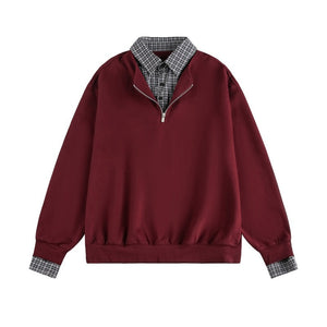 Maroon pullover with plaid collar and cuffs on a white background
