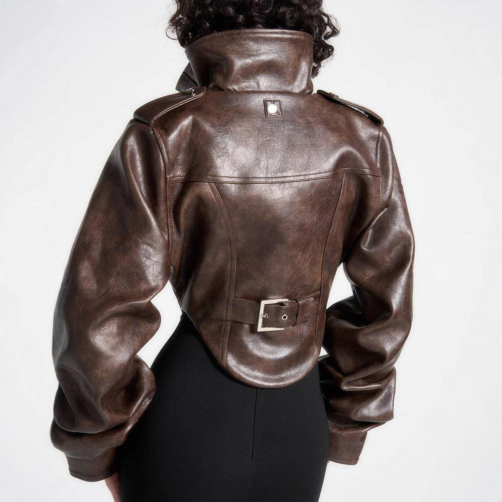 Brown leather jacket worn by a person on a white background