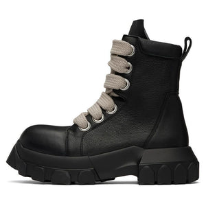Black leather boot with gray laces on a white background