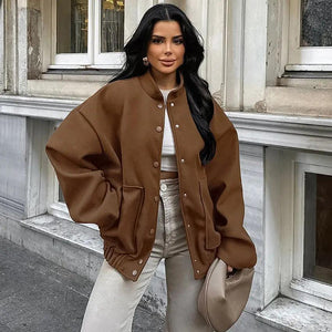 A person wearing a brown vintage woolen stand collar coat with button closures and loose fit.