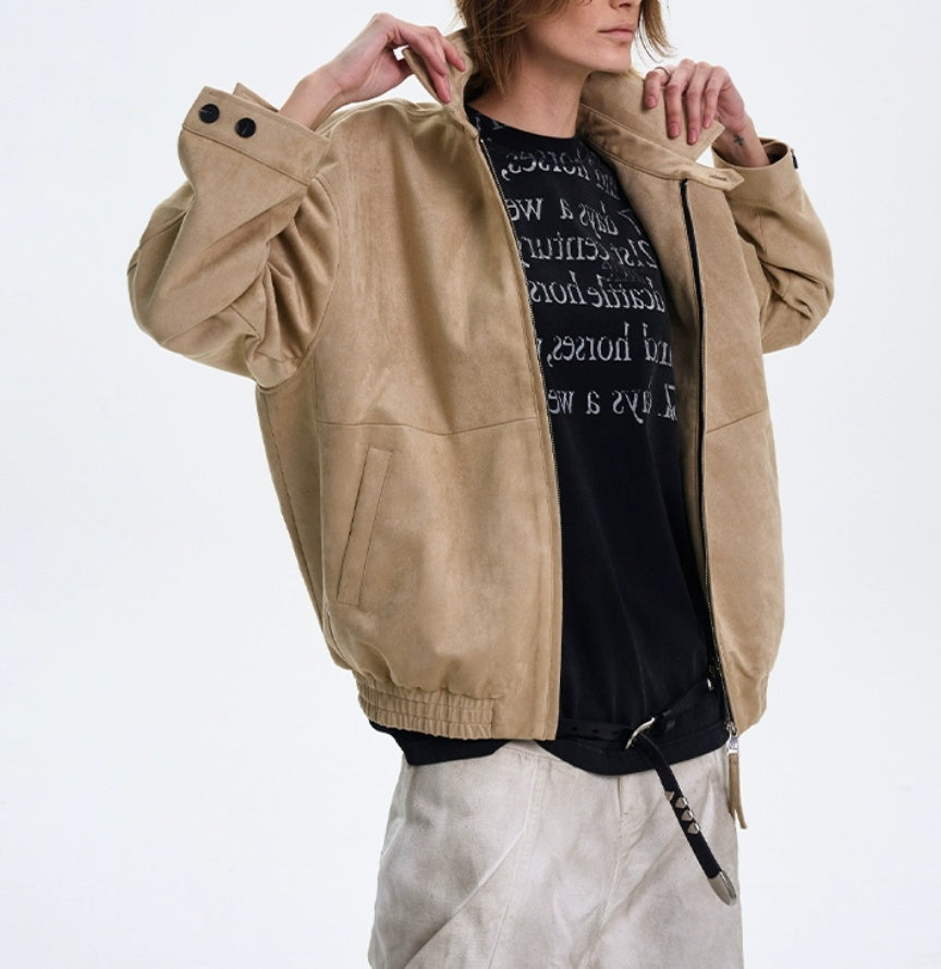 Person wearing a beige jacket over a black shirt with text on a white background