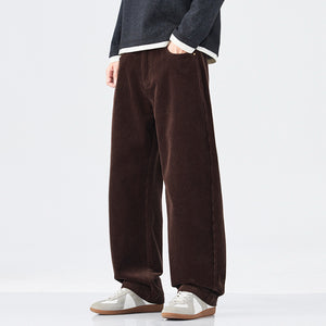 Brown wide-leg pants worn by a person on a white background