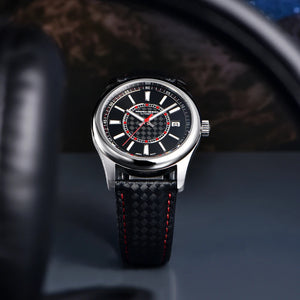 Luxury watch with black strap and detailed face on a dark background