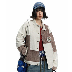 A person wearing a beige and brown color patchwork denim jacket with an irregular design, paired with a red top and blue jeans. Accessories include a cap, necklaces, and carrying a net bag.