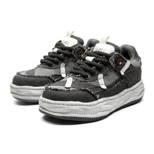 Pair of black and gray sneakers on a white background