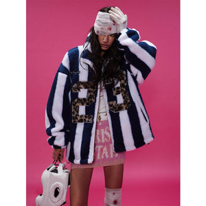 Lamb Wool Coat – Retro Plaid - MRC STOREJacketsMy StoreA woman wearing a blue and white striped plaid coat with a faux fur collar, oversized number print on the front, and paired with a pink skirt and white hat.MRC STORECJPK217128002BYBlue And White StripesL
