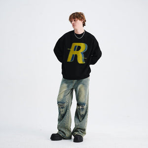 Loose Trendy Round Neck Long Sleeve Sweater - MRC STORESweaters & HoodiesMRC STOREPerson wearing a black sweater with a yellow 'R' logo and blue jeans on a white backgroundMRC STORECJWY229521902BYBlackL