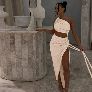 One - Shoulder Dress - Backless Ruched Long - MRC STOREDressMy StoreWoman in a beige dress standing next to stone sculptures in an indoor settingMRC STORECJLY242112303CXApricotL