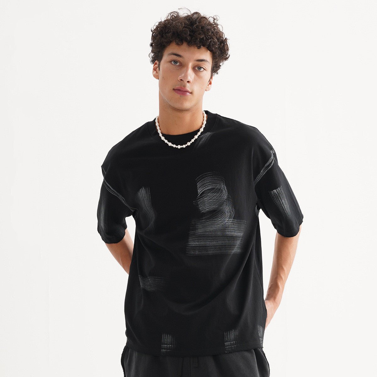 Vintage T-Shirt - Washed Loose Cotton - MRC STORET-ShirtsMy StoreA man wearing a washed black vintage t-shirt with a round neckline and short sleeves.MRC STORECJYH235349104DWBlackL