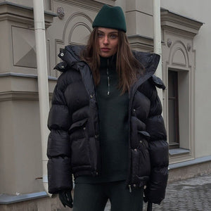 Warm Cotton - Padded Hooded Overcoat - MRC STOREJacketsMRC STOREPerson wearing a black puffer jacket and green beanie standing in front of a building.MRC STORECJJK255502303CXBlackL