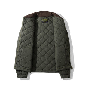 Quilted jacket with diamond pattern on a white background