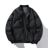 Black puffer jacket on a white background