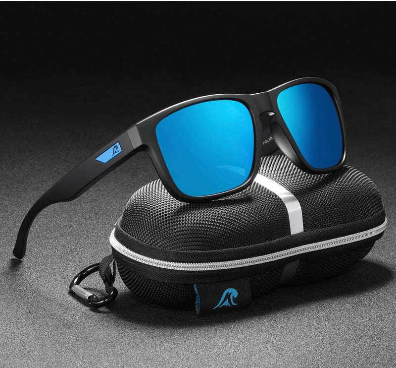 Sunglasses with blue lenses on a black case against a dark background