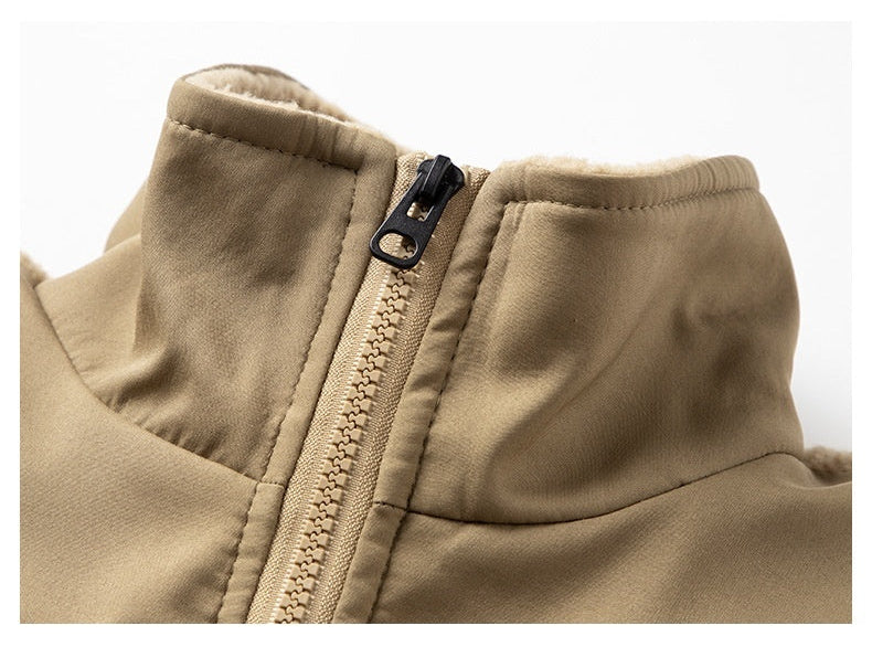 Close-up of a beige jacket with a zipper on a white background
