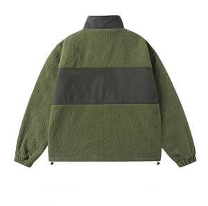 Green fleece jacket with black accents on a white background