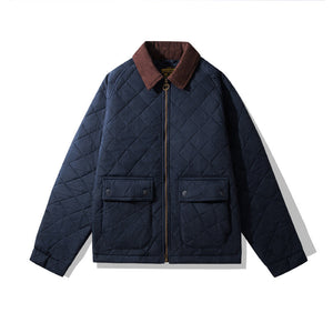 Navy quilted jacket with brown collar on a white background