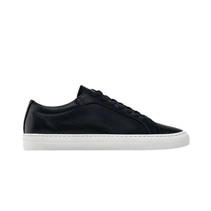 Black sneaker with white sole on a white background