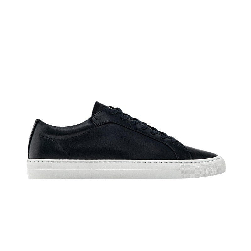 Black sneaker with white sole on a white background