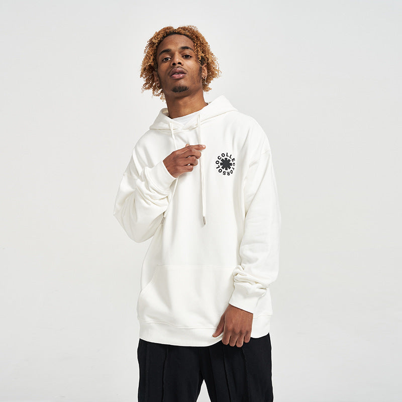 Person wearing a white hoodie with a black logo on a light gray background