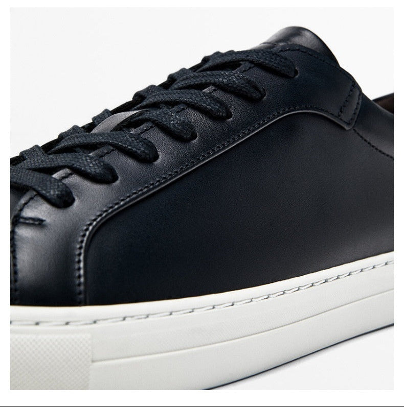 Black sneakers shown in a real shot and digital display on a white background.