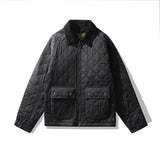 Black quilted jacket on a white background