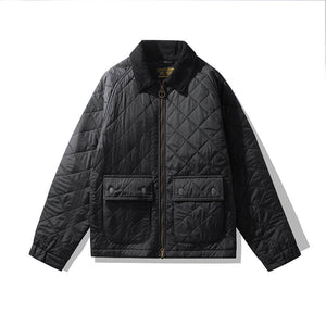 Black quilted jacket on a white background