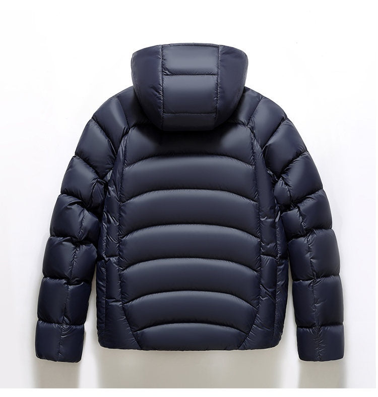 Navy blue puffer jacket on a white background