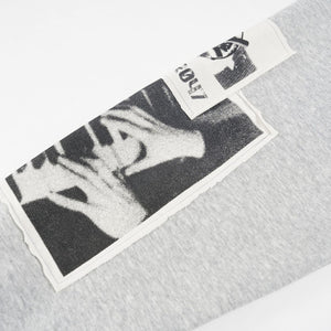 Gray sweatshirt with black and white graphic print on a white background