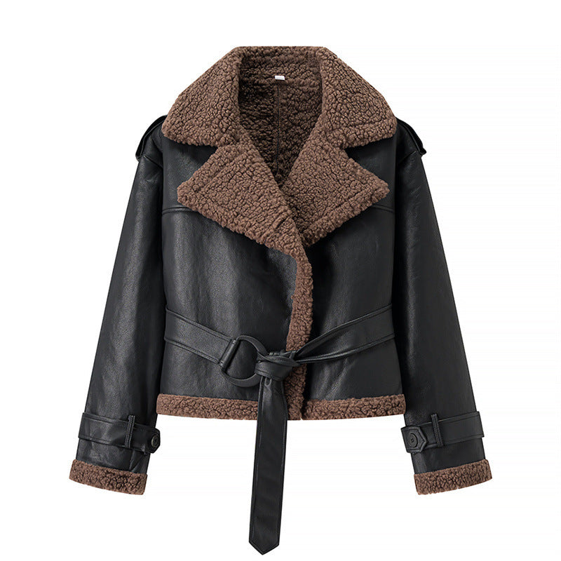 Black leather jacket with brown shearling collar and cuffs on a white background