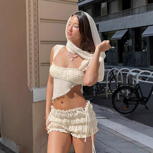 side angle view of women's high waist hot shorts with ruffled waistband – streetwear style