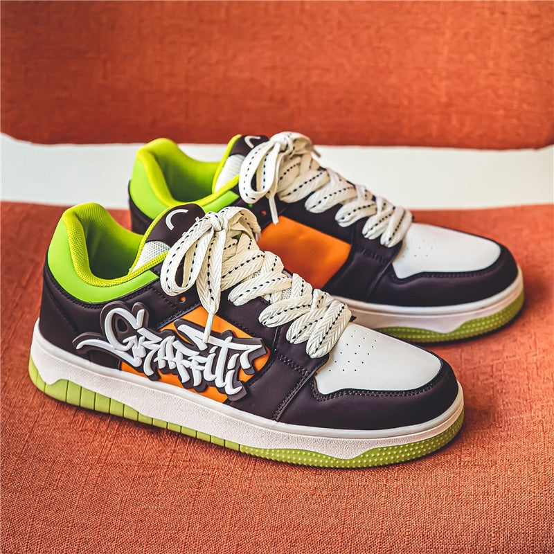 Colorful sneakers with a brand logo on an orange background
