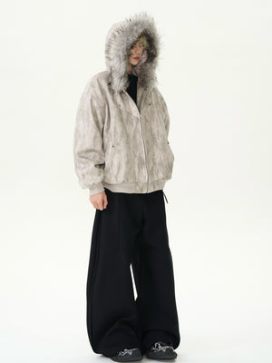 Person wearing a beige hooded jacket with fur lining on a white background