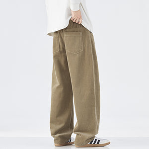 Person wearing beige corduroy pants on a white background