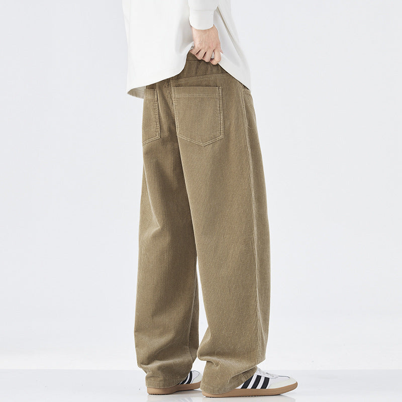 Person wearing beige corduroy pants on a white background
