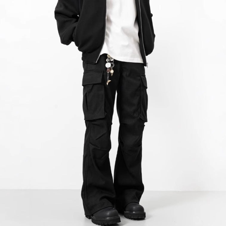 Person wearing black cargo pants on a white background