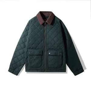 Green quilted jacket with brown collar on a white background