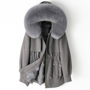 Gray parka coat with a large fur hood on a white background