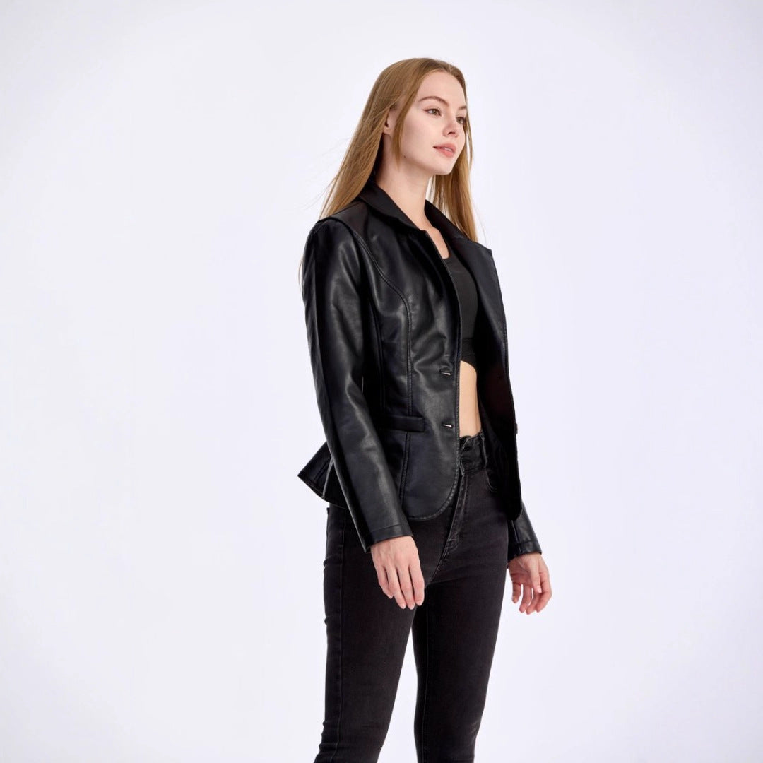 Woman wearing a black leather jacket and pants on a white background