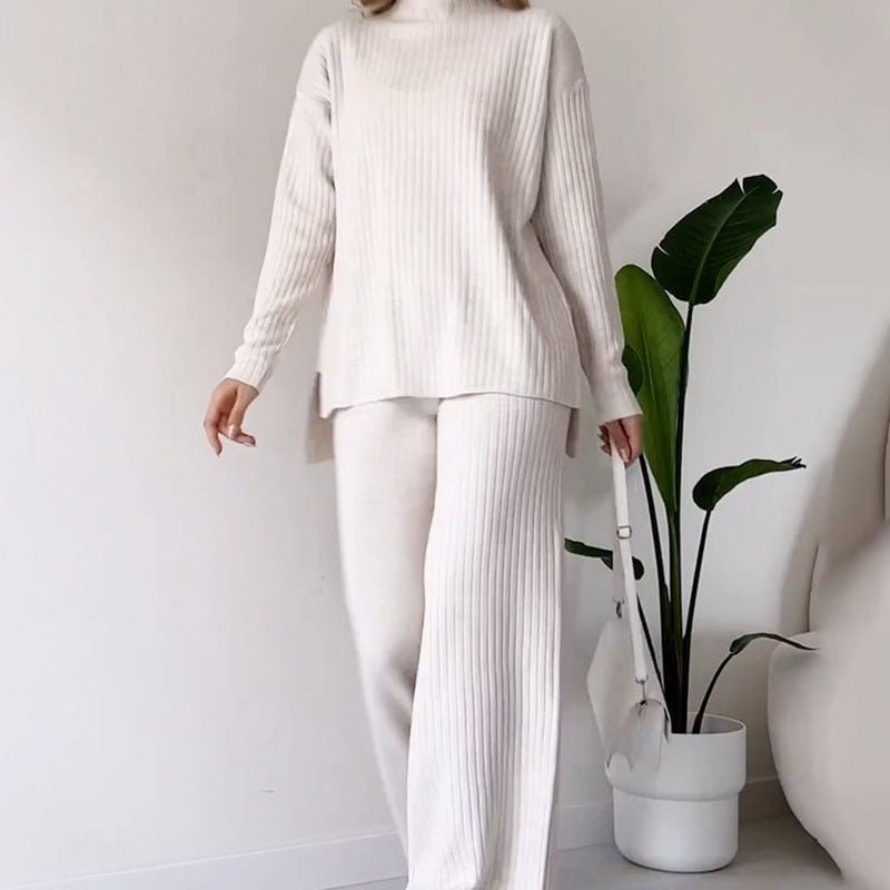Knitted Suit - Turtleneck Loose Set - MRC STOREsetMy StoreA woman wearing a white knitted turtleneck top and matching straight trousers. Accessories include a white handbag and white shoes.MRC STORECJLS213750604DWWhiteL