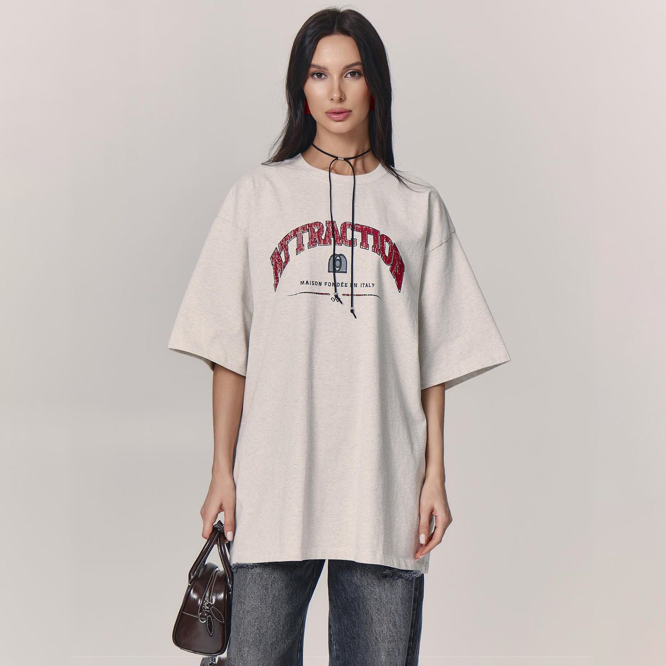 Letter T-Shirt - Loose Shoulder Printed Top - MRC STORET-ShirtsMy StoreWoman wearing a beige oversized t-shirt with a graphic design on a plain backgroundMRC STORECJCS204529003CXGray And WhiteL