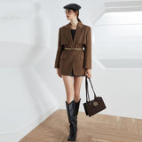 Niche Design Slim - Fit Waist Jacket - MRC STORETopMy StoreA woman models a brown tailored waist jacket with a suit collar, paired with a chain belt, and standing against a minimalist background.MRC STORECJJK164108303CXCoffeeL