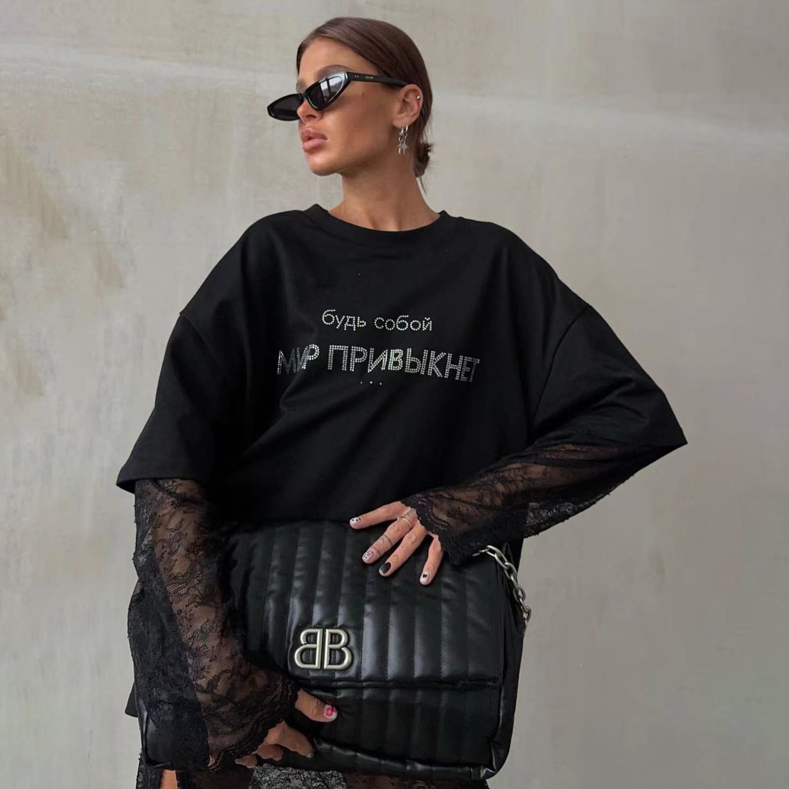 Rhinestone T-Shirt - Loose European Top - MRC STORET-ShirtsMy StoreWoman wearing a black oversized sweatshirt with text, holding a black bag with a logo, against a neutral wall.MRC STORECJCS208242003CXT3786 BlackL