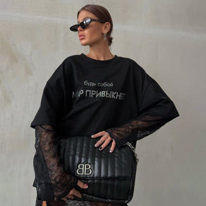 Rhinestone T-Shirt - Loose European Top - MRC STORET-ShirtsMy StoreWoman wearing a black oversized sweatshirt with text, holding a black bag with a logo, against a neutral wall.MRC STORECJCS208242003CXT3786 BlackL